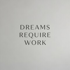 Fototapeta premium Inspirational quote on a plain wall stating that dreams require work to motivate and encourage perseverance and dedication