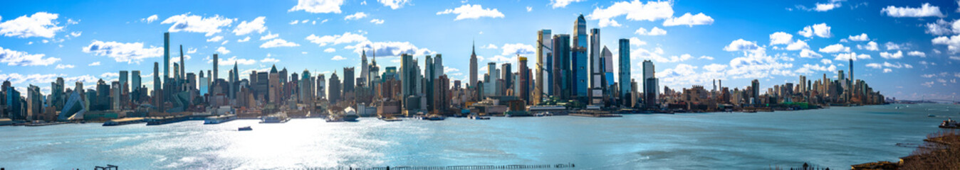 New York City epic skyline and Hudson river under bright sky panoramic view