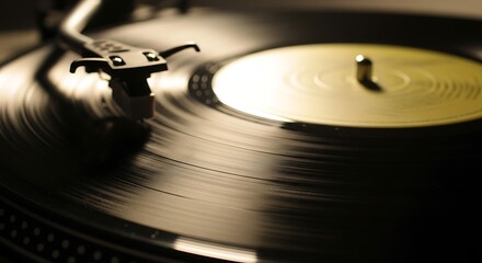 Close-up of a turntable playing a vinyl record with warm light on the grooves and yellow label