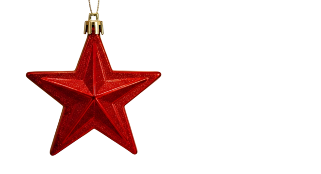 A single shiny red star ornament hangs against a stark black background with copy space