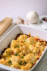 Cauliflower casserole baking with cheese and bacon for dinner