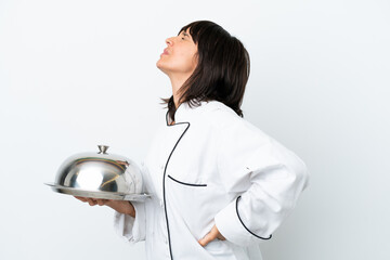 Young chef with tray isolated on white background suffering from backache for having made an effort