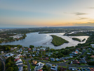 Elevated aerial sunset views of Lillies island and the Tweed River Inlet from Banora Point, New South Wales, Australia