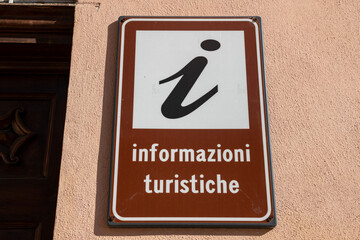 Tourist information sign located in an urban area, a point of reference for orientation and guidance for visitors, clear directions for discovering local attractions, a useful tool for tourism. events