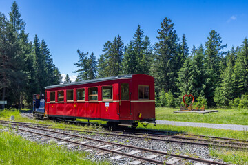 Obraz premium Red historical train on tracks in Pribylina