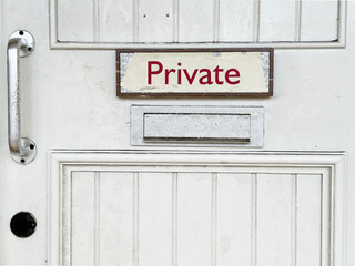 White door with private sign at rear of building