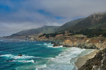 Big Sur secluded beach turquoise ocean fog mountains California