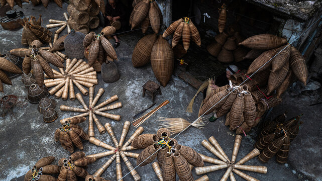 Traditional bamboo fish trap making at Thu Sy craft village, Hai Phong, Vietnam, October 24, 2025.