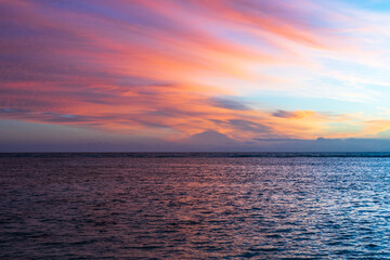 Romantic sunset at Anse Source d’Argent, with golden light reflecting on the turquoise water, iconic granite boulders, and a dreamy tropical beach setting