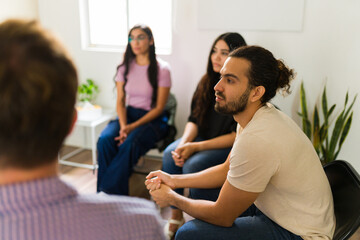Support group engaging in group therapy session