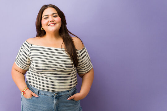 Plus size woman smiling confidently at camera