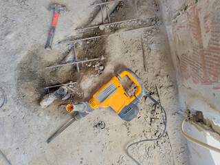 Electric Jackhammer Breaking Concrete with Rebar
