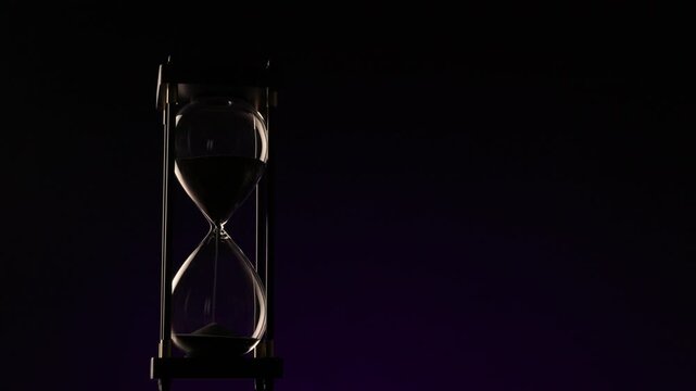 conceptual image of a rotating hourglass in low light, symbolizing eternity, change, and the fragile beauty of every second.