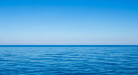 Vibrant blue ocean meets the clear sky on a sunny day at the horizon