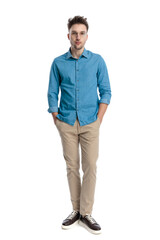 Casual man standing with hands in pockets