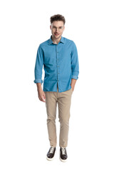 Fototapeta premium Happy casual man walking forward and smiling