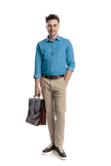 Happy casual man with glasses and briefcase standing
