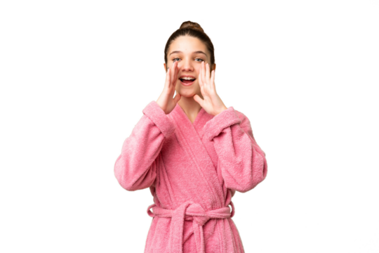 Teenager girl in a bathrobe over isolated chroma key background shouting and announcing something
