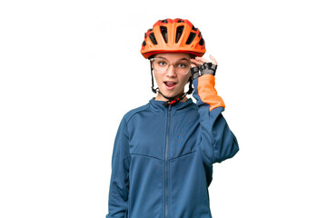 Teenager cyclist girl over isolated chroma key background with glasses and surprised