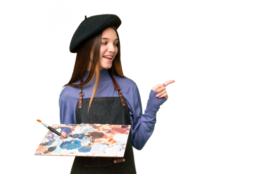 Young artist man holding a palette over isolated chroma key background pointing finger to the side and presenting a product