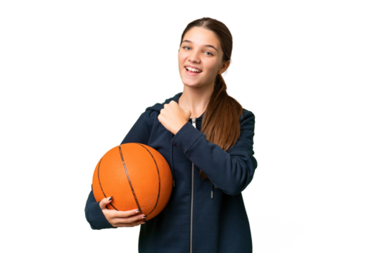 Teenager caucasian girl playing basketball over isolated background celebrating a victory - Powered by Adobe