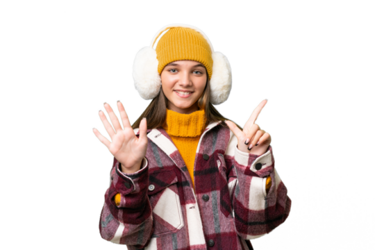 Teenager caucasian girl wearing winter muffs over isolated background counting seven with fingers