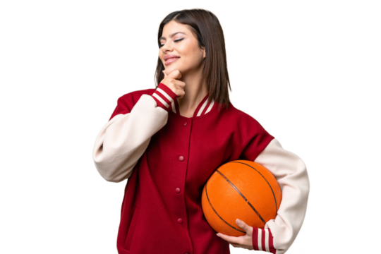 Young Russian woman playing basketball over isolated chroma key background looking to the side and smiling - Powered by Adobe