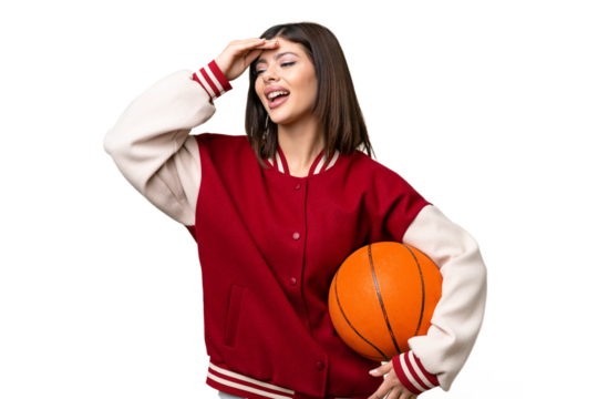 Young Russian woman playing basketball over isolated chroma key background doing surprise gesture while looking to the side - Powered by Adobe