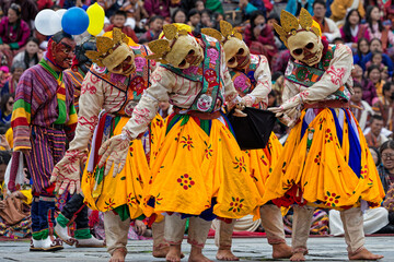THIMPHU, BHUTAN, October 3, 2025 : Masked dancers at the Thimphu Tshechu, a celebrated religious...