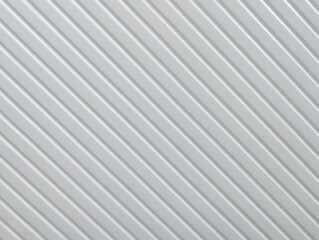 Obraz premium Surface features diagonal lines on a white background highlighting texture and pattern from an interior design perspective in bright lighting conditions