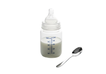 A clear baby bottle filled with milk and a small spoon next to it isolated on transparent background