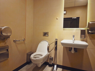 Public disabled toilet. Handrails for people with disabilities