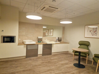 Wroclaw, Poland 09 24 2025: Modern interior design of a public restroom for mother and baby in shopping mall. Mother and child room