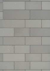 Naklejka premium A seamlessly laid flat surface of uniform tiles creating a smooth and expansive background, ideal for various design projects and architectural concepts ,architecture ,grid ,minimalist