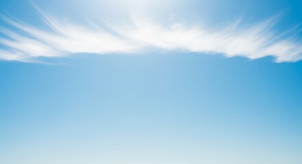 Sky's canvas with clouds: A tranquil display of a bright blue expanse adorned with wisps of white clouds, evokes a sense of freedom and serenity. This image of the sky, with its pure and clear tones.