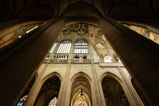 Kutn&aacute; Hora, Czech Republic &ndash; August 8, 2025: Upward view of Gothic vaulted ceiling and stone columns with heraldic coats of arms inside St. Barbara&rsquo;s Cathedral, Kutn&aacute; Hora