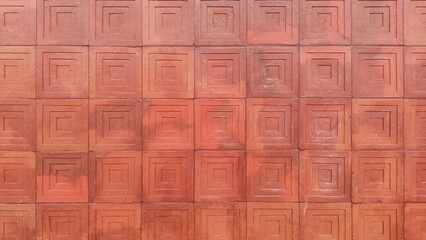 Naklejka premium Texture of terracotta or cement tile in reddish-brown color with a spiral circle pattern.