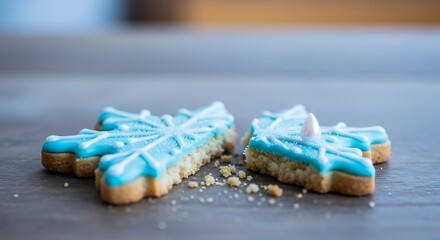 Snowflake Cookies with Blue Icing on Wooden Surface.