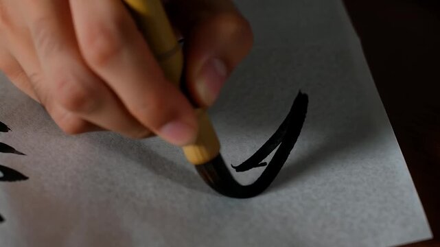 Brushstrokes of traditional calligraphy on textured paper
