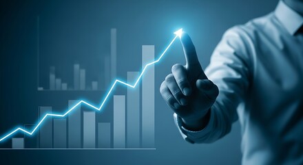 Professional hand points to glowing upward trend line on digital graph, symbolizing business growth and financial success.