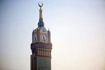 Dramatic view of the Abraj Al-Bait Clock Tower in Mecca against a clear sky