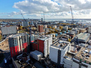 A construction site dominated by cranes , emphasizing growth and the evolution of the urban landscape in modern cities in London UK