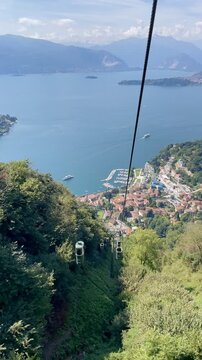 Panoramic view of Laveno-Mombello and Lake Maggiore, seen from Funivia Monte Sasso del Ferro, Lombardy, Italy.