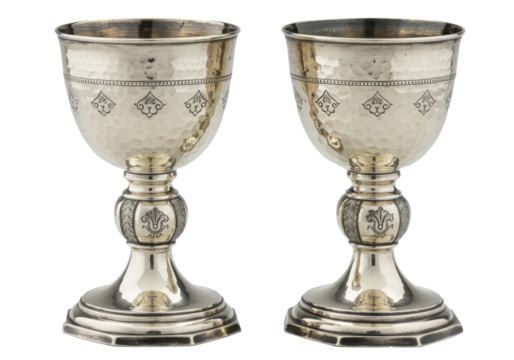 two ornate antique silver chalices, highly polished with hammered texture and repoussé detailing, displayed in a high-key studio product shot against transparent copy space. concept of ancient luxury