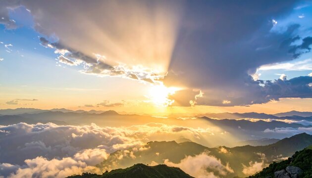Dramatic sunset over mountain range with sunbeams piercing clouds - Powered by Adobe