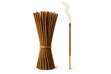 Incense sticks bundle tied together with an individual stick burning, releasing smoke and a flame, conveying aromatherapy and peace