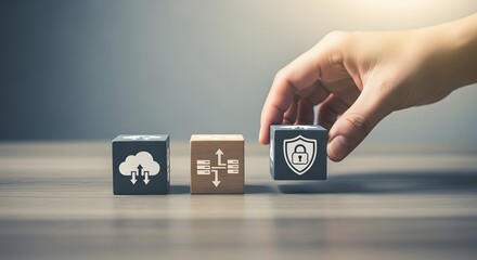 Hand placing a security icon cube on a table with other icons