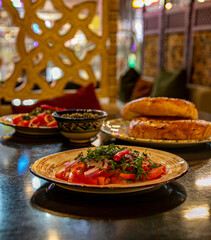 Still life. Salad with red tomatoes. Traditional cuisine of Central Asia.