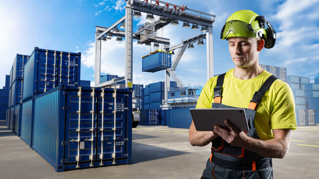 Man at marine cargo terminal. Man with tablet near shipping containers. Gantry crane at logistics port. Person in uniform and helmet at outdoor container warehouse. Container cargo terminal.