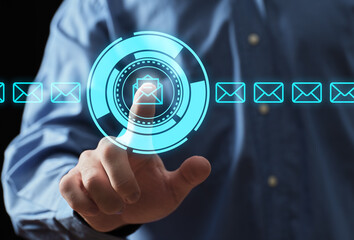 Finger touching email icon on holographic interface